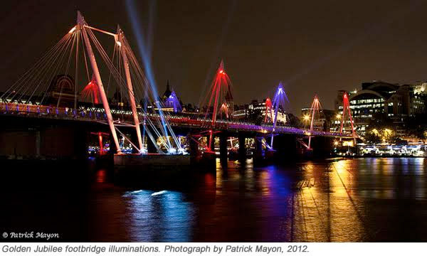 Bridge with neon lights glowing at night