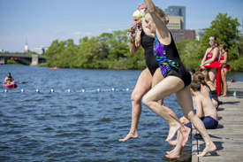 Swimmers jump into Boston's Charles river